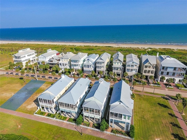 aerial view featuring a view of the beach and a water view