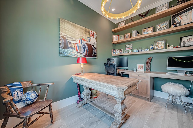 office space with built in desk and light hardwood / wood-style floors