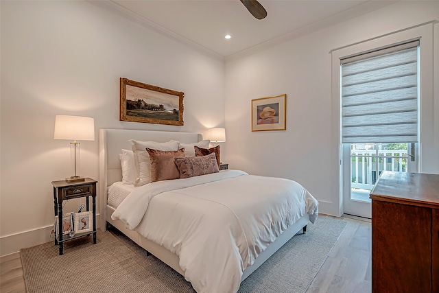 bedroom with access to exterior, light hardwood / wood-style floors, ceiling fan, and ornamental molding