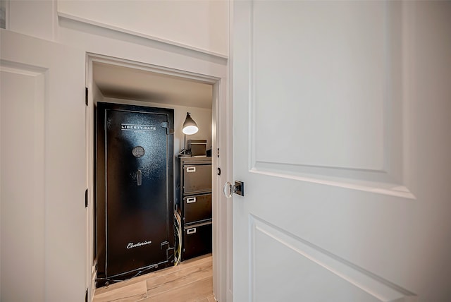 hallway with light hardwood / wood-style flooring