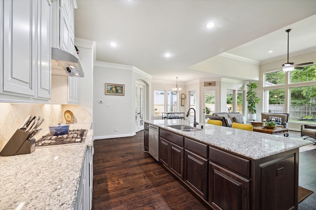 kitchen with sink, dark brown cabinets, a center island with sink, stainless steel appliances, and dark hardwood / wood-style floors