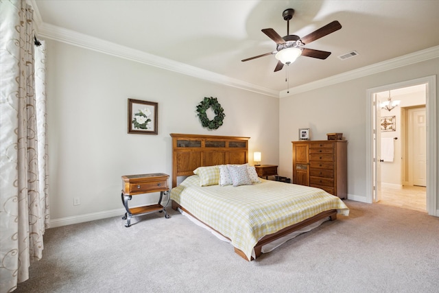 carpeted bedroom featuring ornamental molding, ceiling fan with notable chandelier, and ensuite bathroom