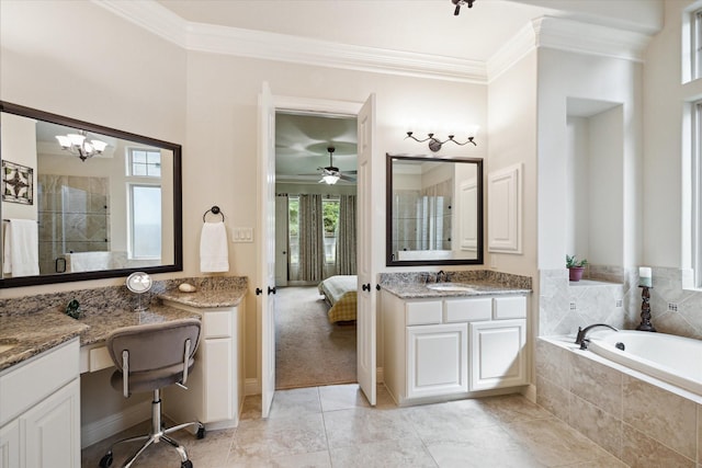 full bath with a tile shower, ceiling fan with notable chandelier, crown molding, tiled bath, and vanity