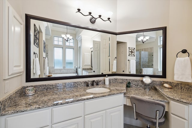 bathroom featuring a chandelier, a shower, vanity, and crown molding