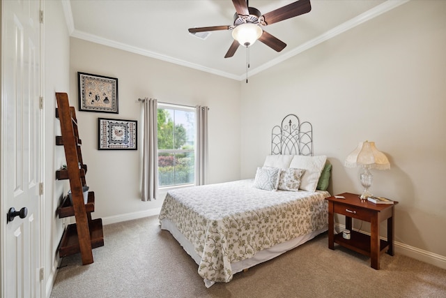 bedroom with ornamental molding, ceiling fan, and carpet floors