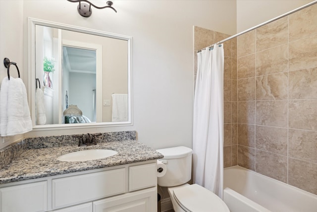 full bathroom with vanity, shower / bath combo with shower curtain, and toilet