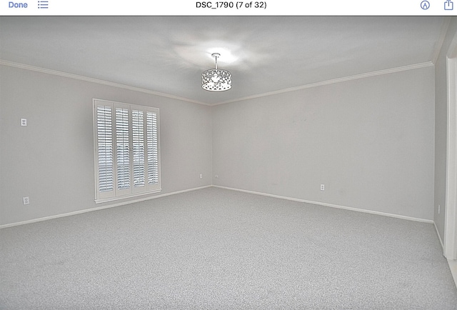 empty room with ornamental molding and carpet floors