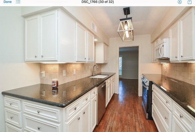 kitchen with hanging light fixtures, white cabinetry, sink, and stainless steel dishwasher