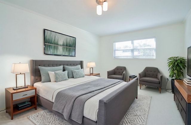 carpeted bedroom with ornamental molding