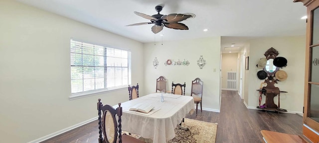 dining space with ceiling fan and dark hardwood / wood-style floors