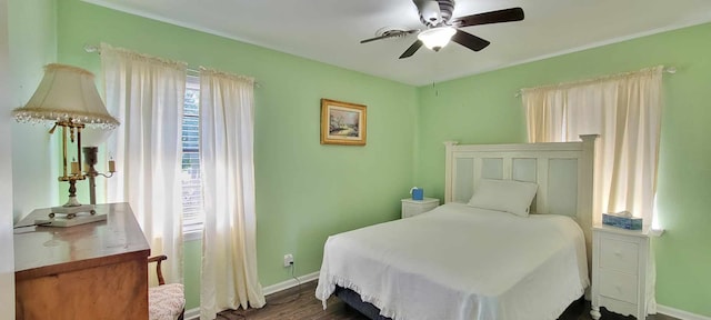 bedroom featuring dark hardwood / wood-style floors and ceiling fan