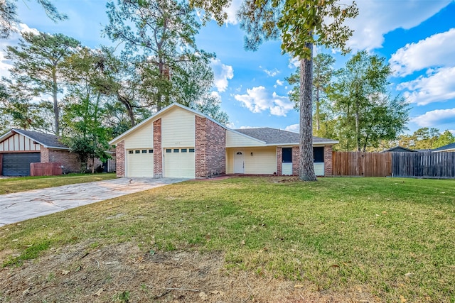 ranch-style home with a front lawn and a garage