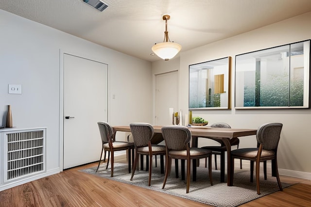 dining area featuring hardwood / wood-style flooring