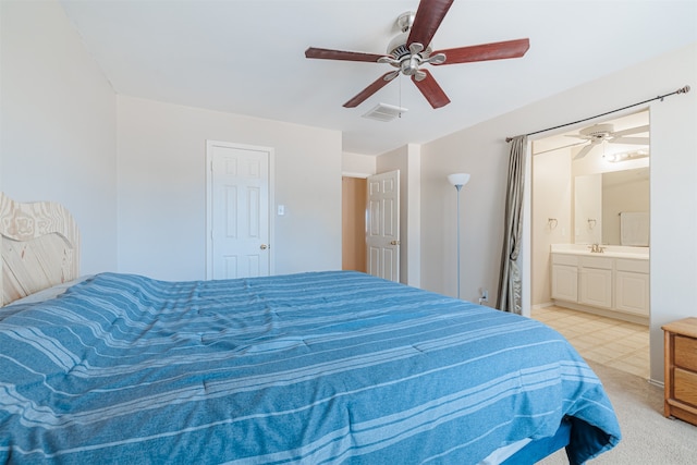 carpeted bedroom with ceiling fan, sink, and connected bathroom