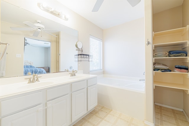 bathroom with vanity and a bathtub