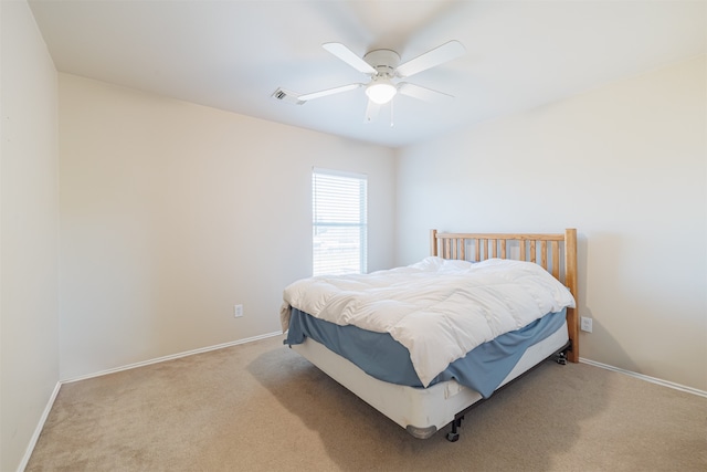 bedroom with light colored carpet and ceiling fan