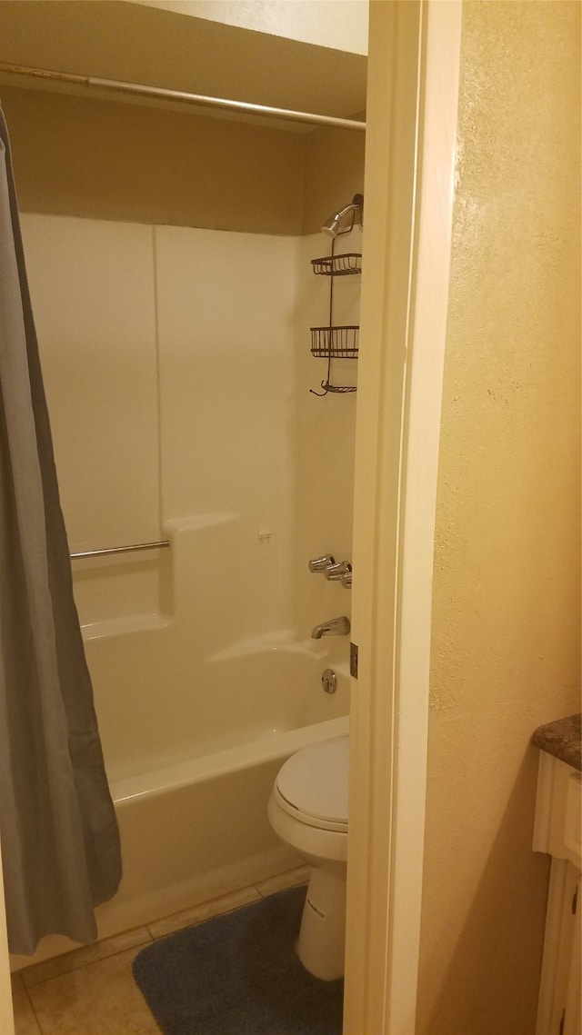 full bathroom with shower / tub combo with curtain, vanity, toilet, and tile patterned floors