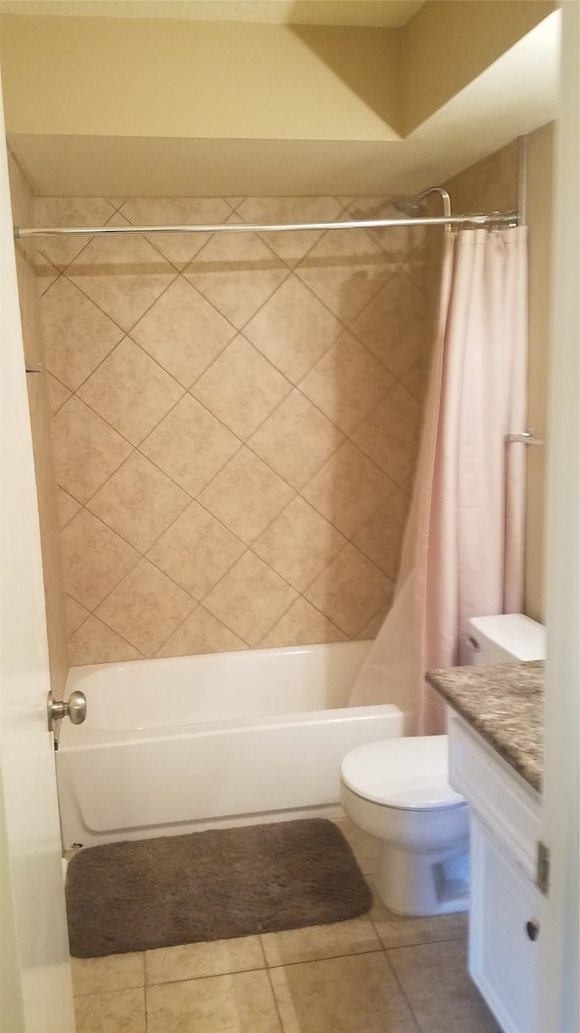 full bathroom with shower / bath combo, tile patterned flooring, vanity, and toilet