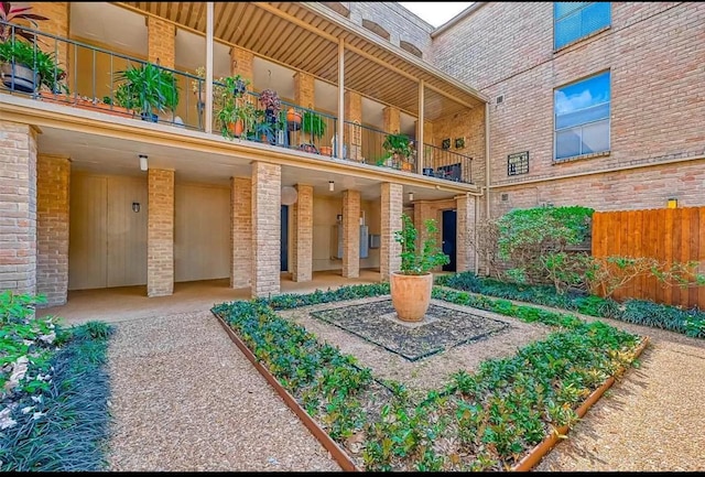 exterior space with fence and a balcony