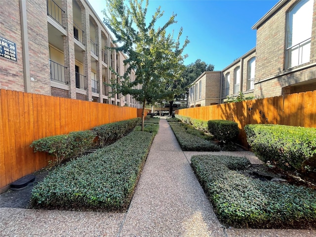 view of home's community with fence