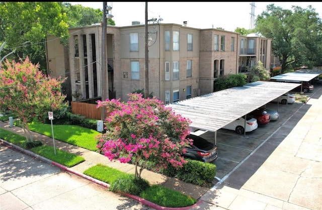 surrounding community featuring covered parking