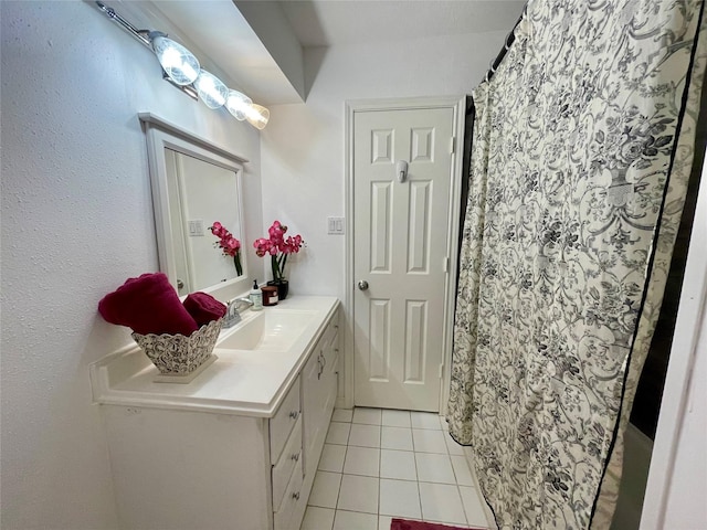 full bathroom with tile patterned floors and vanity