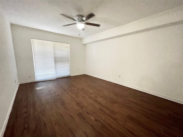 unfurnished bedroom featuring ceiling fan, baseboards, and dark wood-style floors