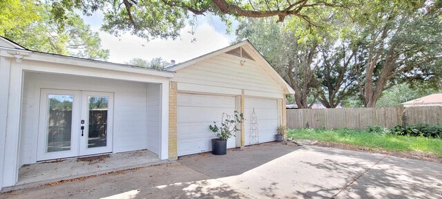 8 Abalone St, Bay City, TX 77414 - detached garage featuring french doors and fence