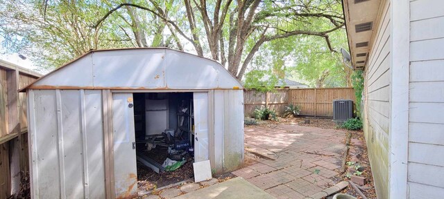 8 Abalone St, Bay City, TX 77414 - view of shed with a fenced backyard and central AC