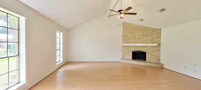 8 Abalone St, Bay City, TX 77414 - unfurnished living room featuring healthy amount of natural light, light wood finished floors, ceiling fan, and lofted ceiling
