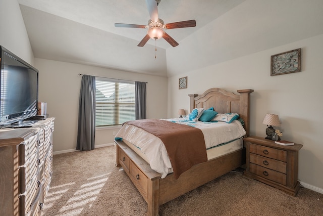 bedroom with lofted ceiling, ceiling fan, and light colored carpet