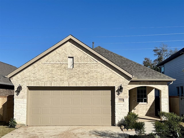 view of front of property featuring a garage