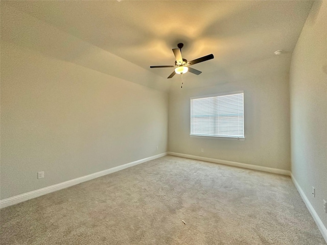 unfurnished room with vaulted ceiling, ceiling fan, and carpet flooring