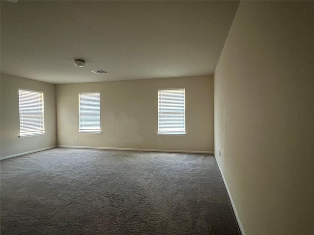 331 W Bend Dr, League City, TX 77573 - unfurnished room with baseboards and dark carpet