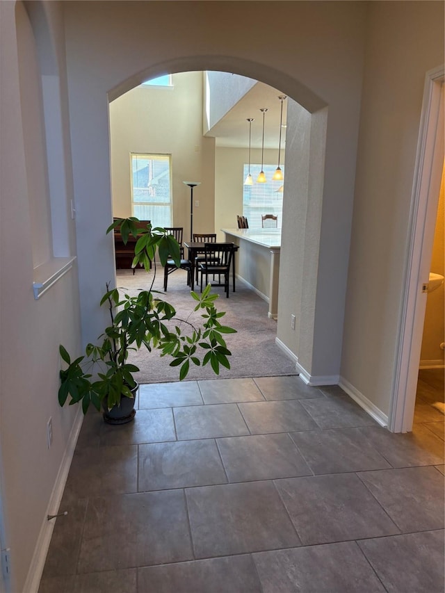 331 W Bend Dr, League City, TX 77573 - hallway with arched walkways and tile patterned flooring