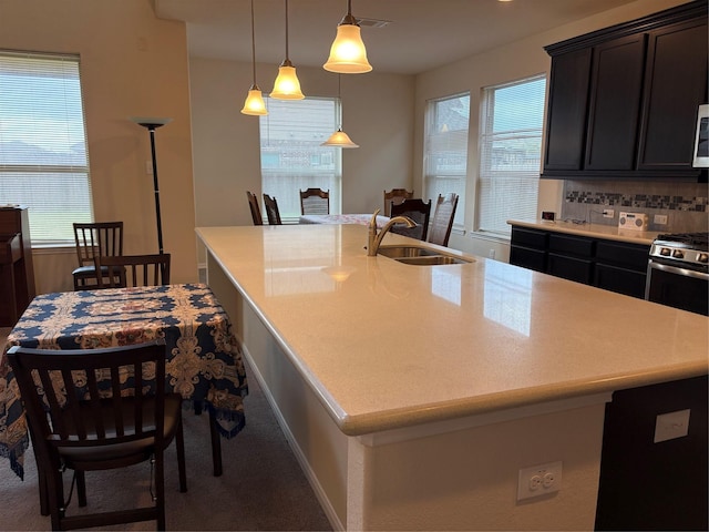 331 W Bend Dr, League City, TX 77573 - kitchen with light countertops, carpet flooring, and stainless steel appliances
