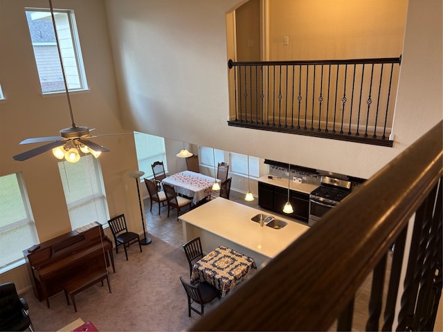 331 W Bend Dr, League City, TX 77573 - carpeted living area featuring a ceiling fan and a towering ceiling