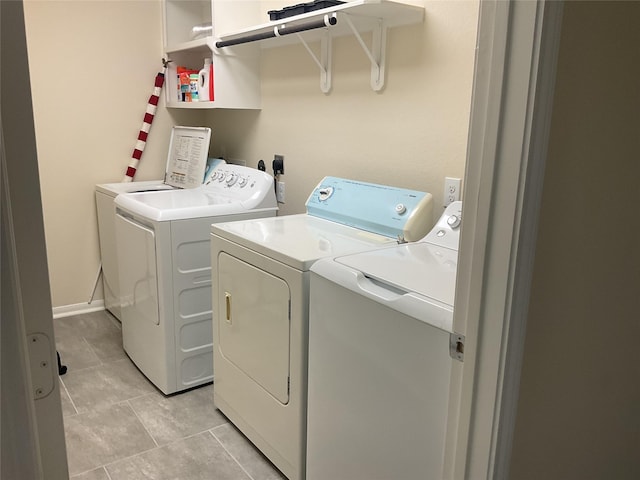 331 W Bend Dr, League City, TX 77573 - laundry room featuring independent washer and dryer and light tile patterned floors