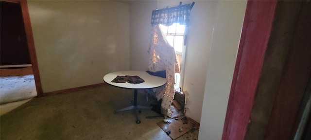 235 W Hartel St, Sour Lake, TX 77659 - unfurnished dining area with carpet flooring and baseboards