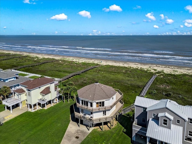 drone / aerial view with a beach view and a water view