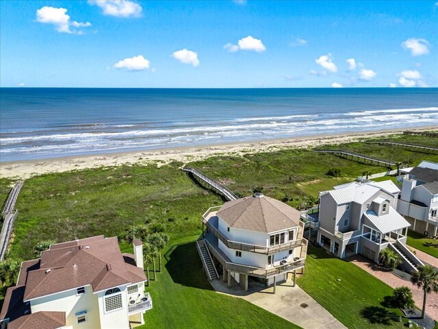 bird's eye view featuring a water view and a view of the beach