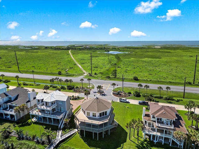 birds eye view of property with a water view and a rural view