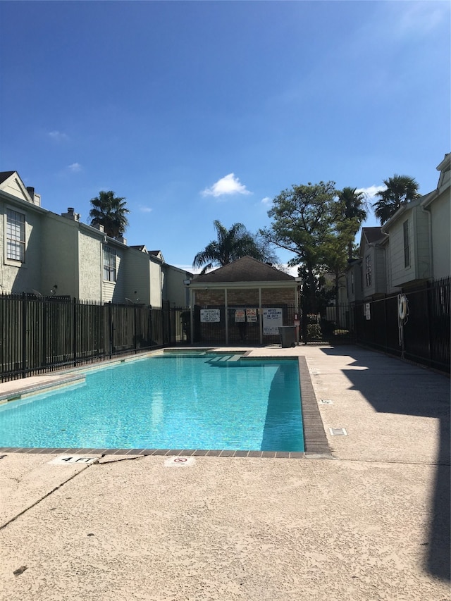 view of swimming pool featuring a patio and a gazebo