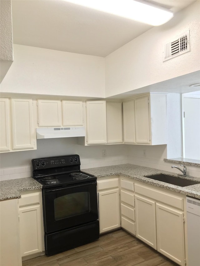 8733 Victorian Village Dr, Houston, TX 77071 - kitchen with visible vents, under cabinet range hood, a sink, dishwasher, and black / electric stove