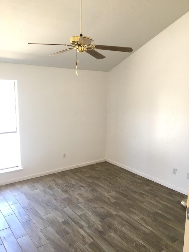 8733 Victorian Village Dr, Houston, TX 77071 - unfurnished room with baseboards, a ceiling fan, lofted ceiling, and dark wood-style floors