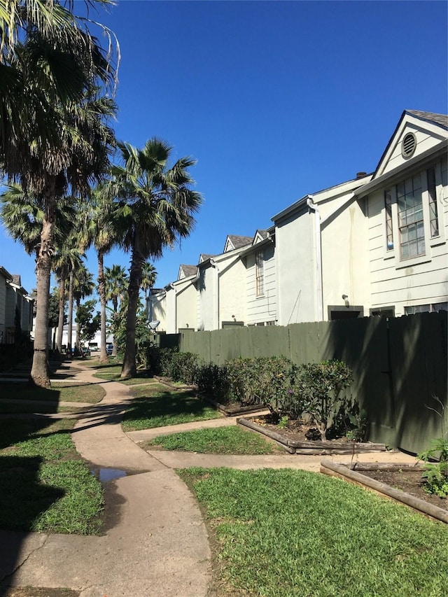8733 Victorian Village Dr, Houston, TX 77071 - exterior space with fence, a yard, and a residential view