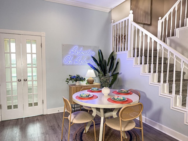 dining area with stairway, baseboards, wood finished floors, and crown molding