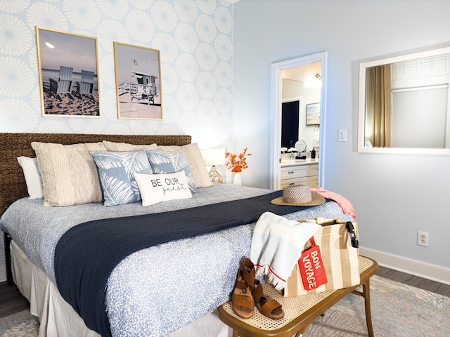 bedroom with wood finished floors and baseboards