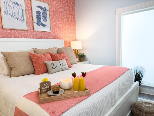 bedroom with wallpapered walls