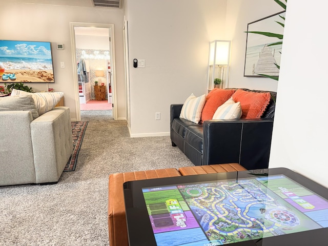 living room featuring carpet flooring and baseboards